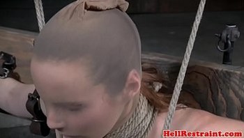 BDSM slave gets restrained in dark dungeon