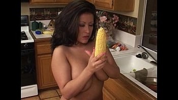 Fat brunette inserts corn and cucumbers in pussy