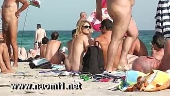 naomi1 handjob a young guy on a public beach