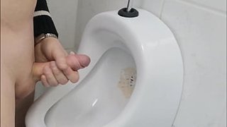 Jerking off on a public toilet