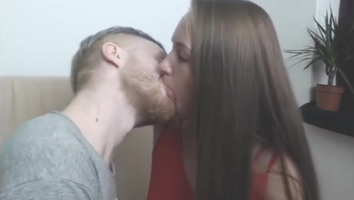 young webcam couple can't stop kissing