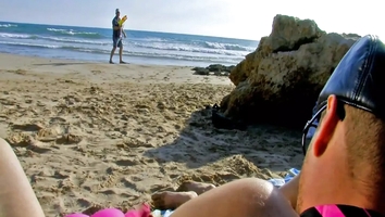 My wife gave her ass to a stranger on the beach during our summer vacation. She fucked him and me right there in public