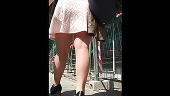 Milf in short black skirt and nude pantyhose upskirt